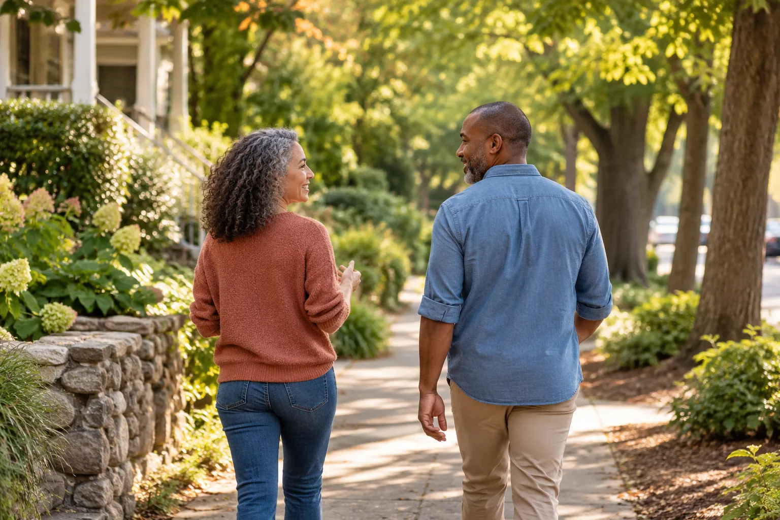 A quiet shared walk in a leafy neighborhood with comfortable distance and natural light